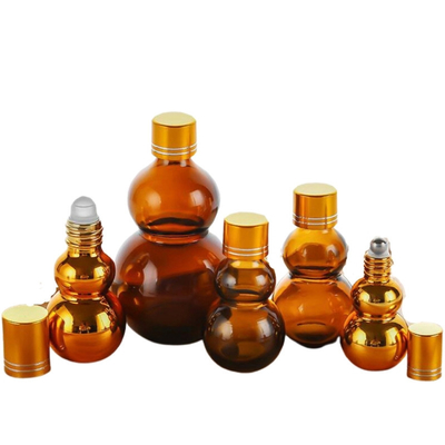 Customisable Premium 10ml / 50ml / 100ml Amber Glass Perfume Oil Roll On Bottles With Golden Mirror Finish Dual Golden Caps & Thickened Base